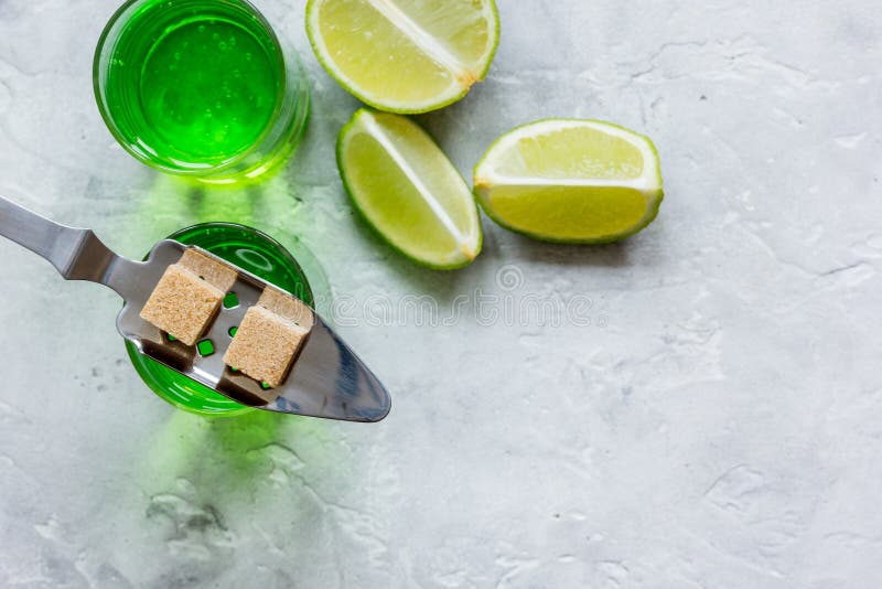 Download Absinthe With Sugar Cubes In Spoon On Stone Background Top ...