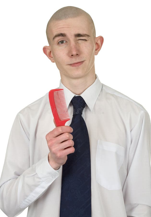 Absolutely bald guy with a hairbrush in a hand. Absolutely bald guy with a hairbrush in a hand