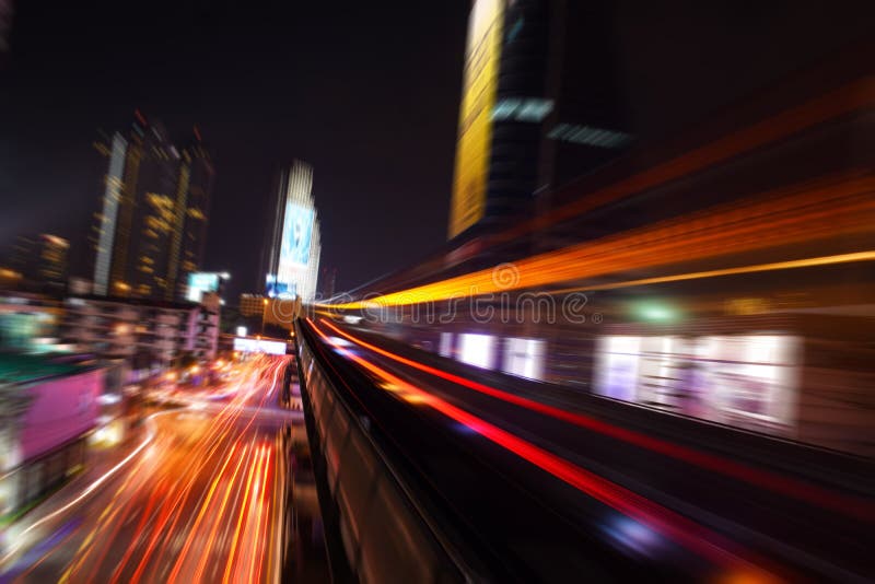 Abstract acceleration speed motion light Blur from Sky Train at night (background). Night train stock images, royalty-free photos and pictures