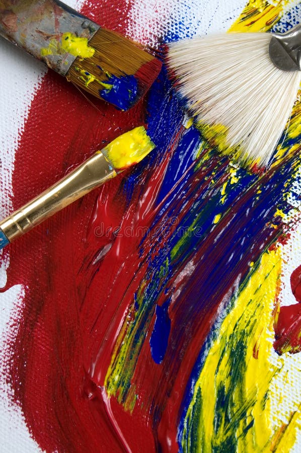 Abstract Acrylic Paint and Brushes on Canvas Viewed from Above Stock