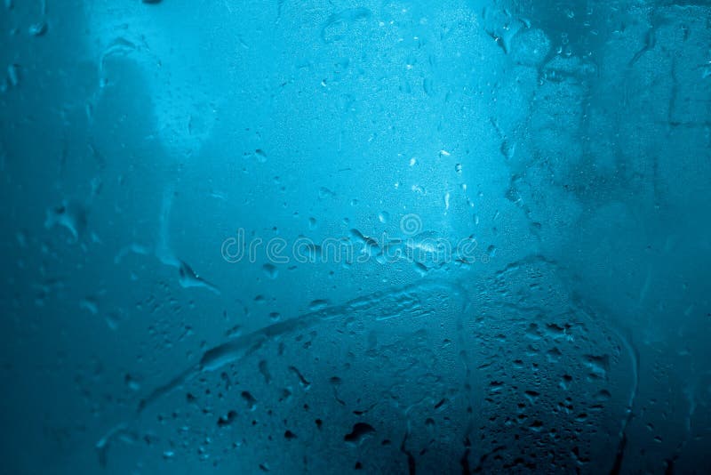 Abstract blue background. Water drops on glass. Window color reflection background stock images, royalty-free photos and pictures