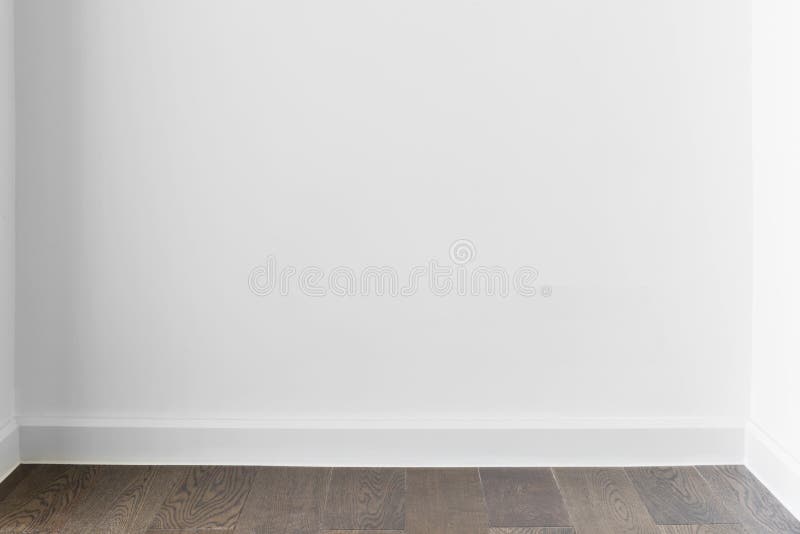 Abstract background from blank white concrete wall at home or office with wooden floor. Picture for add text message. Backdrop for royalty free stock image Abstract background from blank white concrete wall at home or office with wooden floor. Picture for add text message. Backdrop for royalty free stock image