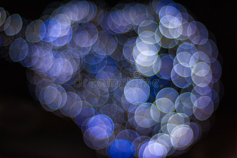 Abstract background of bokeh Christmas tree. Xmas decoration lights.Copy space.