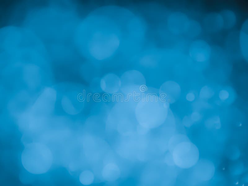 Abstract background with bubble bokeh in blue color