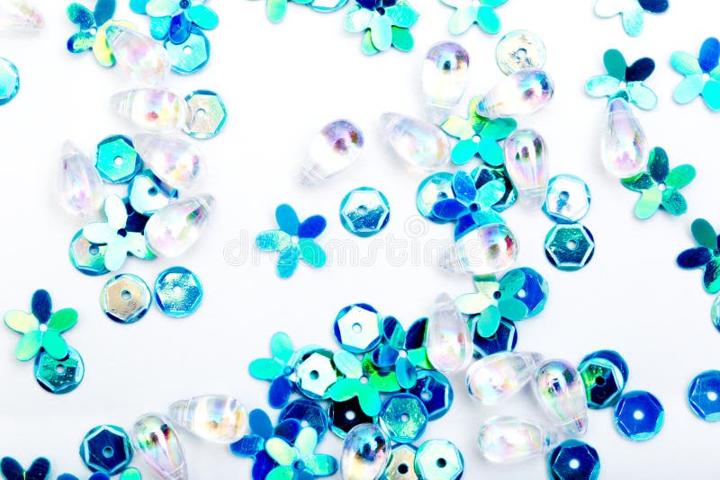 Abstract Background Close Up of Blue, Green Silver Sequins on Stock