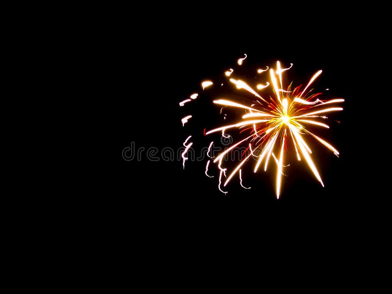 A nice contrast of a clear black night sky and fireworks bursting into a multi-layered star of white, red and yellow lights. Overlapping exploding fireworks stock images, royalty-free photos and pictures