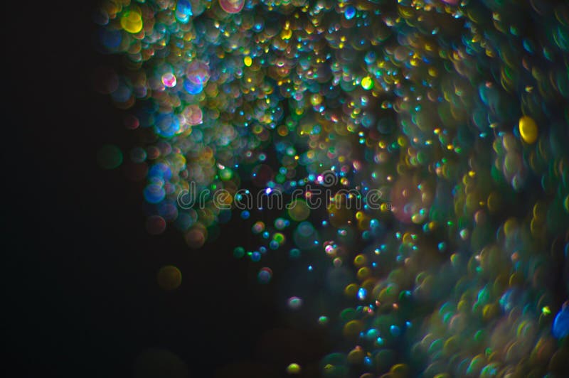 Abstract background with glittering defocused particles. Abstract background with glittering defocused bokeh multicolor particles