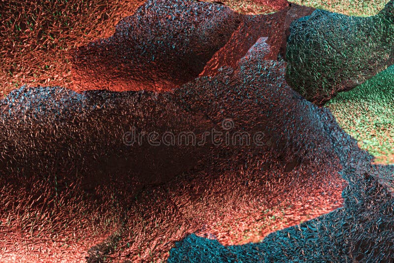 Abstract background of glossy silver textured ragged foil with colorful illumination. stock images