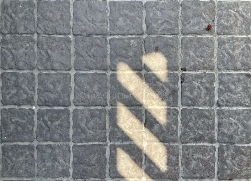 Abstract background : Light and Shadow on grey concrete blocks floor. royalty free stock images