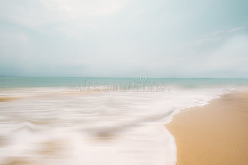 A seascape abstract beach background. panning motion blur with a long exposure, pastel colors in a vintage and retro style. A seascape abstract beach background. panning motion blur with a long exposure, pastel colors in a vintage and retro style.