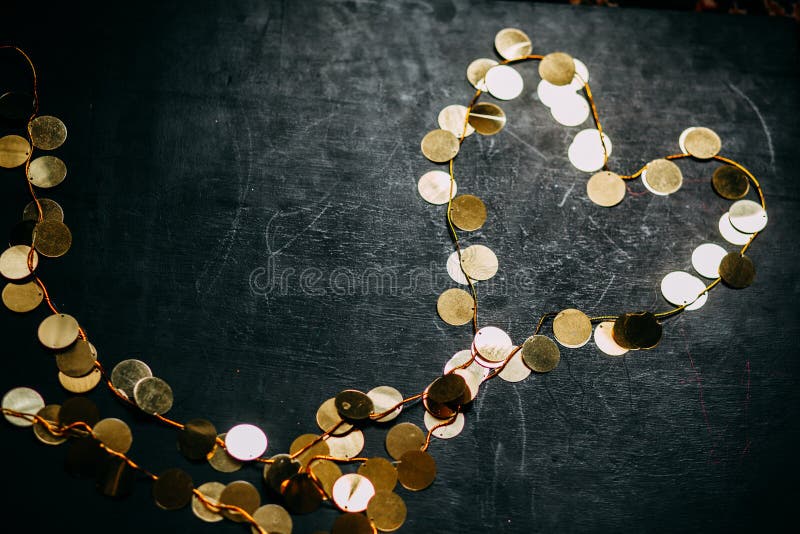 Abstract Black Background with a Garland with Gold Round with Beads