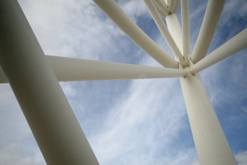 An abstract pattern formed by some white pipes in a blue background. An abstract pattern formed by some white pipes in a blue background