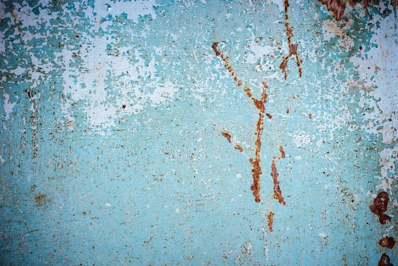 Abstract blue brown texture with grunge cracks. Cracked paint on a metal surface. Urban background with rough paint transitions. T