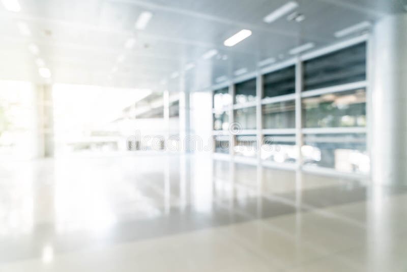 Abstract blur and defocused in empty office building with glass