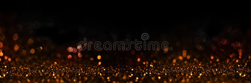 Abstract blur golden glitter on black background. Card for new year, christmas and wedding celebration. Party bokeh sparkle confetti textured layout. Classy elegant design