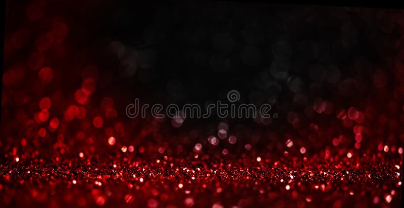 Abstract blur red glitter on black background. Card for Valentine`s day, christmas and wedding celebration. Love bokeh sparkle