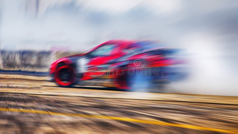 Abstract blurred drift cars with smoke from burned tire