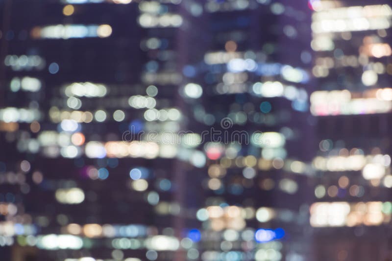 Abstract bokeh background of modern building in the city.Colorful of Night blurred bokeh in downtown twilight