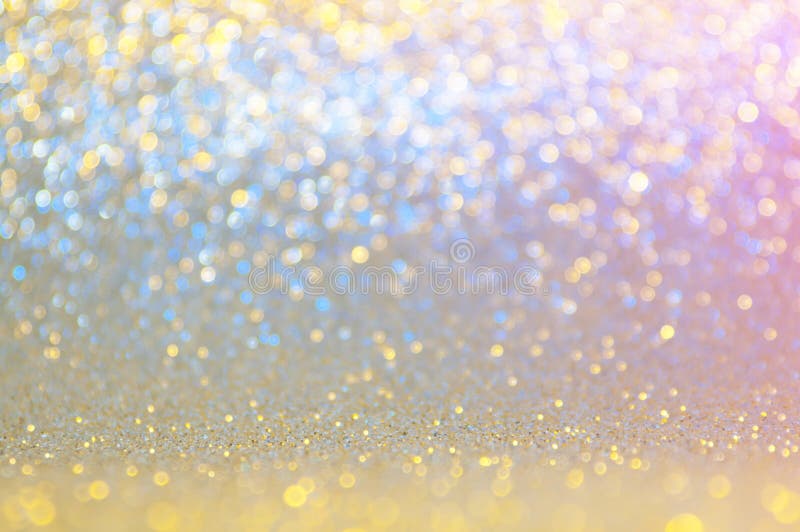 Abstract bokeh blue ,pink,gold,yellow colors with light background.Blue night light elegance,smooth sparkling glittering wallpaper