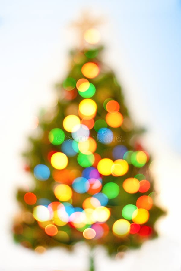 Abstract bokeh Christmas tree, magic colorful blurred background. Abstract bokeh Christmas tree, magic colorful blurred background.