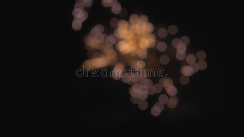 Abstract bokeh lights of real fireworks exploding in the sky. Slow motion stock footage