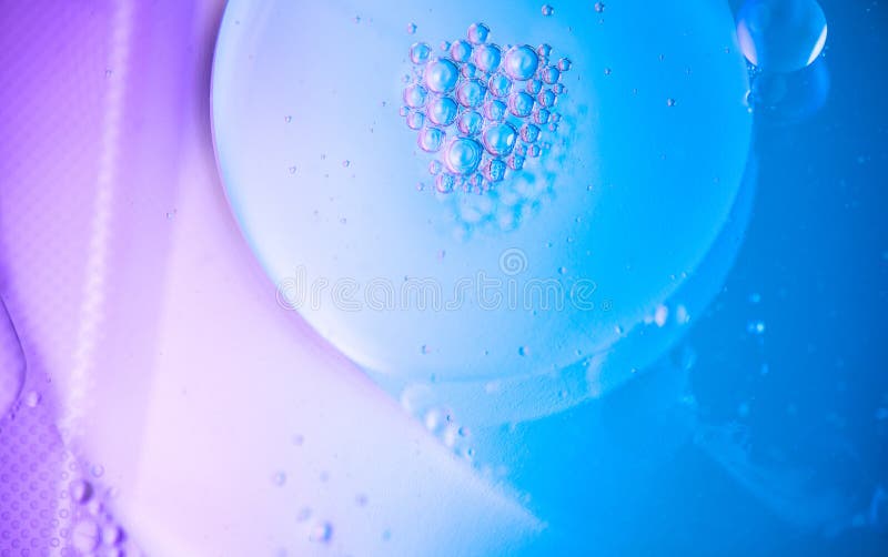 Abstract bubbles floating background. Liquid blue abstract backdrop. Flowing colorful abstract rounds texture. Beautiful blue and violet art design. Liquid. Wallpaper. Flowing Surface