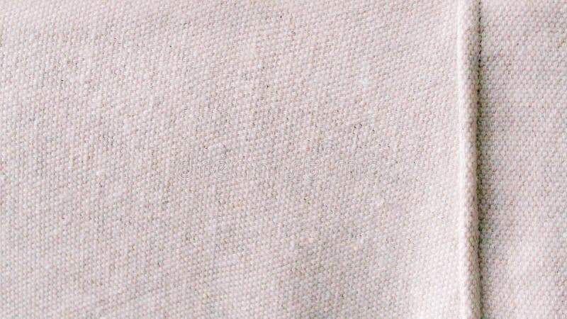 abstract close-up texture canvas fabric as background neutral minimalist simple textile