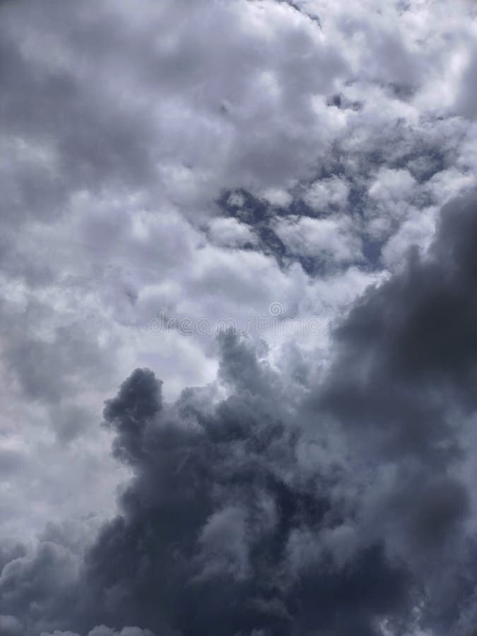 Abstract cloudscape featuring a variety of gray tones and textures, reminiscent of an approaching storm.