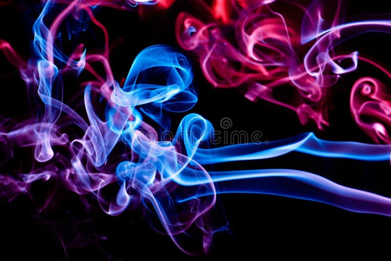 Abstract colored smoke isolated on a black background. Blue and pink swirls of smoke. Abstract colored smoke isolated on a black background. Blue and pink swirls of smoke.