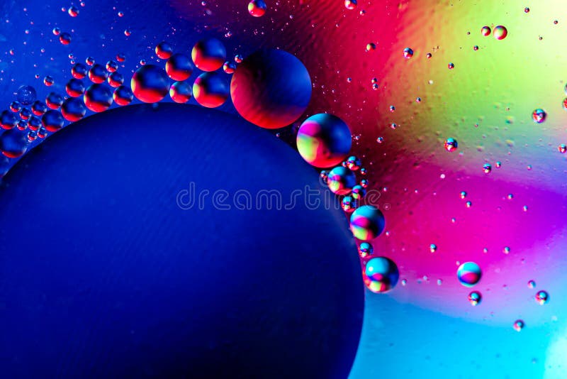 Abstract Colorful Background with Oil on Water Surface. Oil Drops in