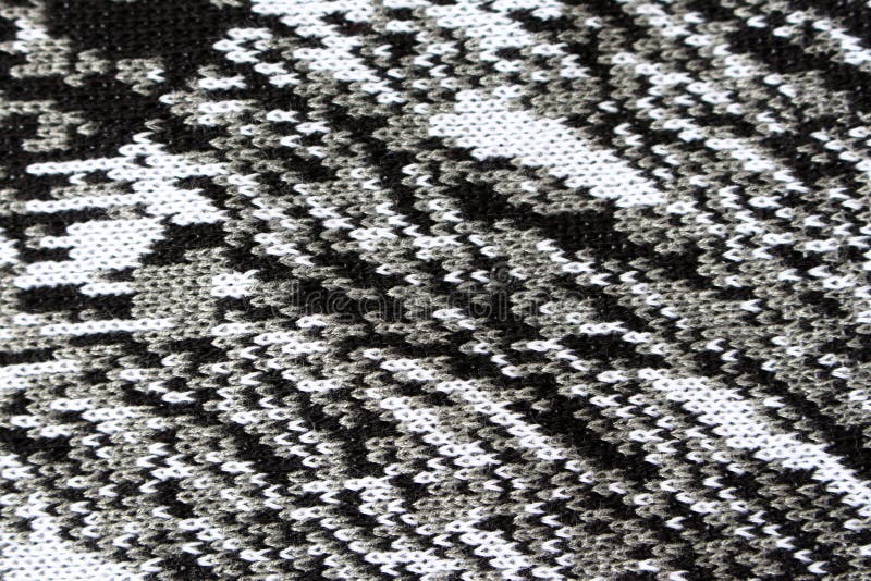 Abstract knitted texture as background gray white and black threads