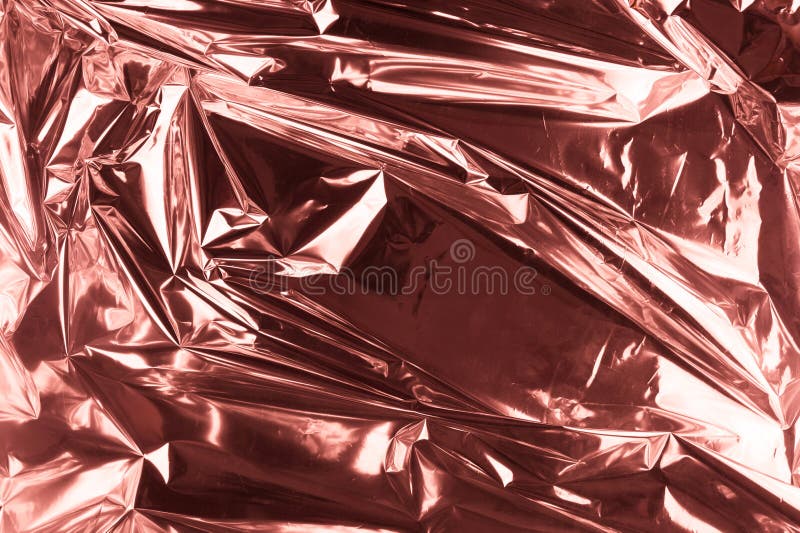 Abstract crumpled foil background. Grunge photo background. Rose gold stock image Abstract crumpled foil background. Grunge photo background. Rose gold stock image