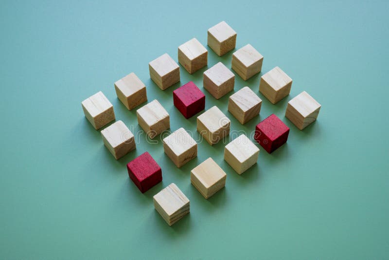Abstract cubes and a few special ones as a symbol of uniqueness and talent. stock images