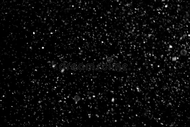 Abstract dust particles on dark background royalty free stock images
