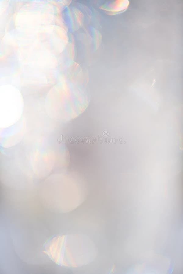 Abstract glowing bokeh background. Grey holiday glow backdrop. Defocused Background stock photo
