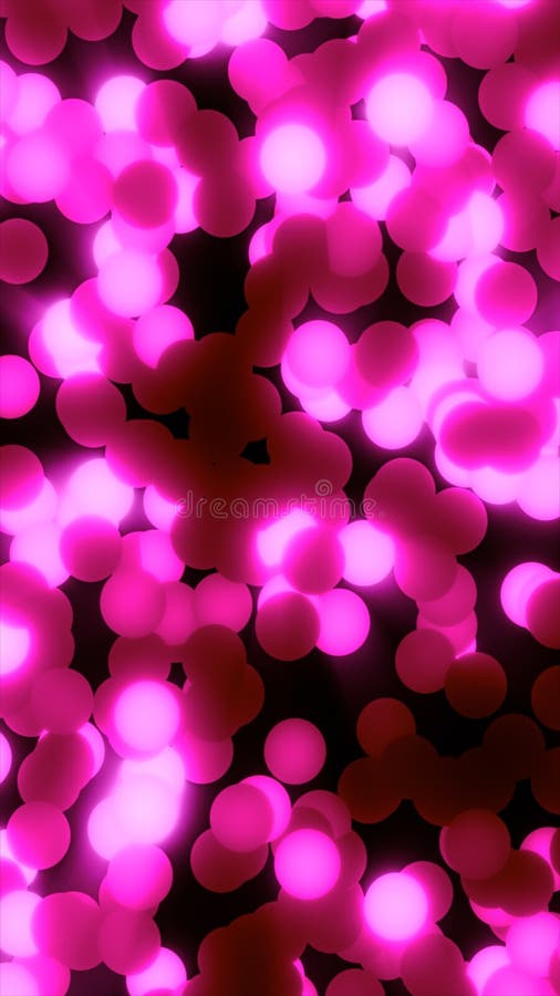 Abstract glowing pink orbs floating in a dark space with radiant light effects royalty free stock photography