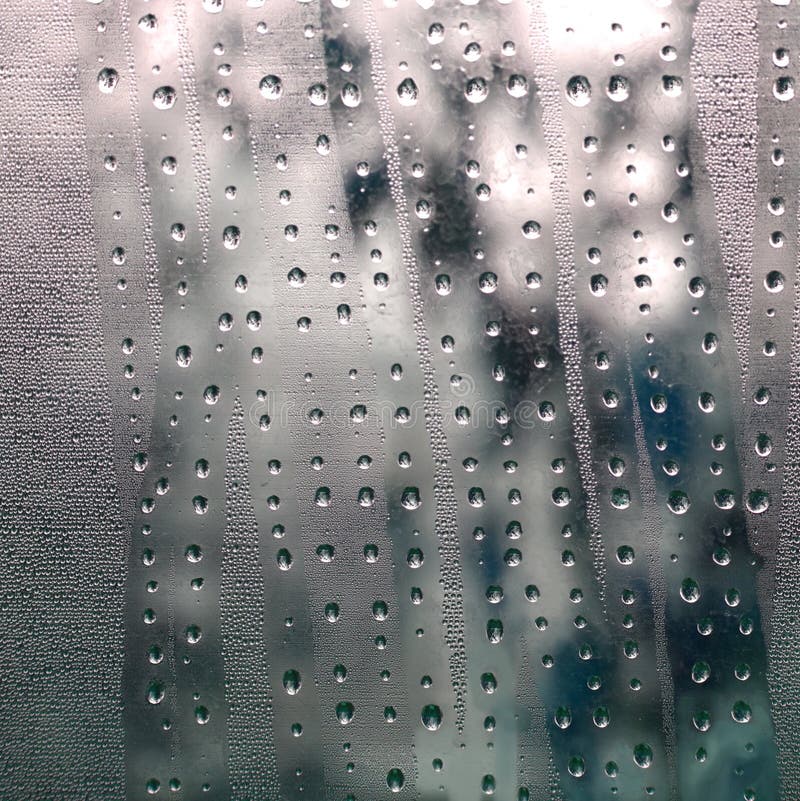 Abstract gray texture of condensed mist on a cold glass