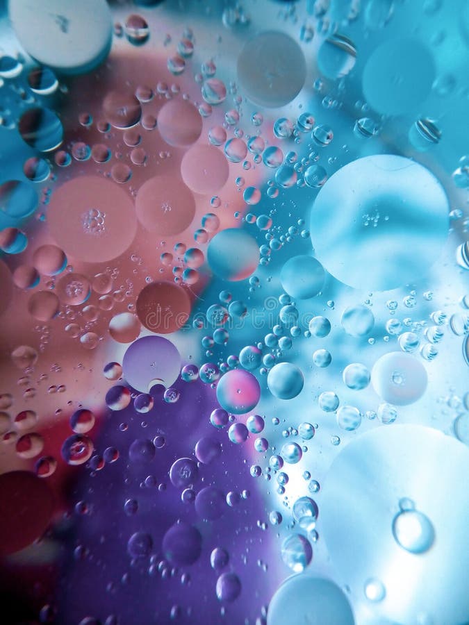 abstract image of oil and water in a glass bowl sitting on a colorful surface. abstract image of oil and water in a glass   on a colorful surface. abstract image of oil and water in a , colorful texture in the background. abstract image of oil and water cob, grain, corn, harvest, kernel, color, eat, healthy, background, closeup, diet, food, fresh, corncob, maize, row, line, cereal, cook, crop, ingredient, ripe, vegetable, agriculture, corn cob, details, drops, gold, golden, health, whole, close, macro, nutrition, organic, pattern, raw, texture, yellow, natural, -up, oil, abstract, drop, liquid, water, ellipse, bubble, effect, fluid, circle, paint, surface, wallpaper, art, backdrop, decoration, design, colour, graphic, mixed, research, science, swirl, aqua, ic, artwork, canvas, contemporary, creativity, droplet, flow, , , illumination, image, , objects, shape, , , , , vivid,