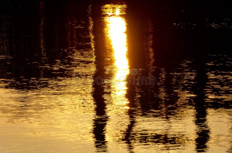 Abstract image of sunset lighting reflecting off of water