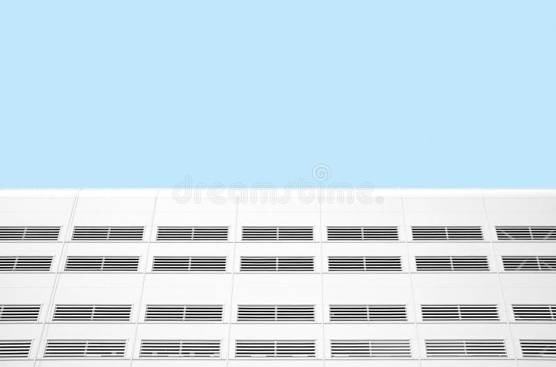 Abstract industrial building wall against blue sky stock photo