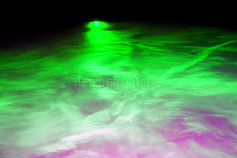 Photo of abstract laser light show with green and purple colours ideal for background etc.