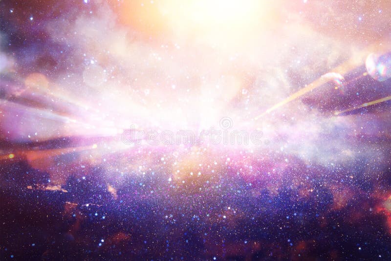 Abstract lens flare. concept image of space or time travel background over dark colors and bright lights.
