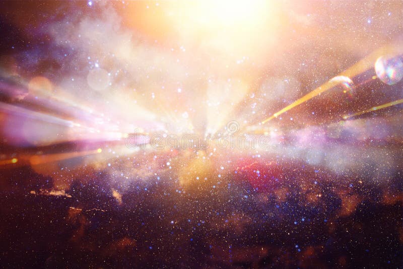 Abstract lens flare. concept image of space or time travel background over dark colors and bright lights.