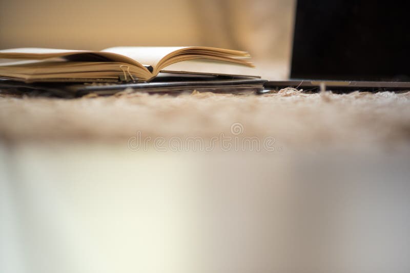 An abstract low-angle view of the pages of an open journal next