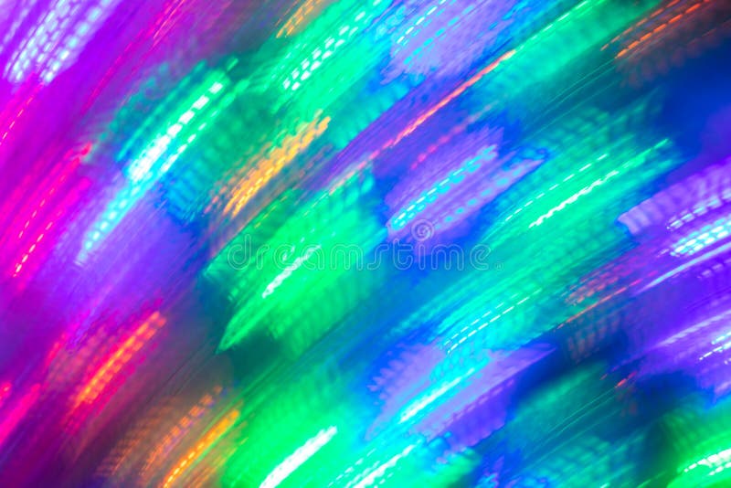 Abstract luminous seamless background of blurred bright diagonal neon lights as backdrop or wallpapers. Photographic effect of long exposure. Trendy colors. Abstract luminous seamless background of blurred bright diagonal neon lights as backdrop or wallpapers. Photographic effect of long exposure. Trendy colors.