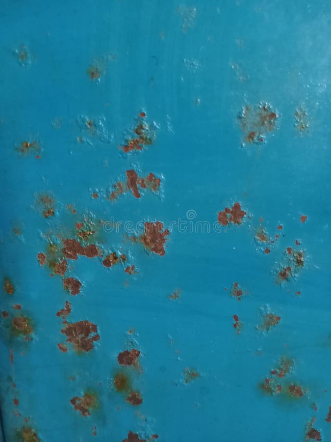 Abstract metal texture in blue with rust spots stock images