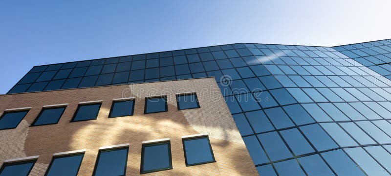 Facade of modern office building in glass and steel with reflections of blue sky
