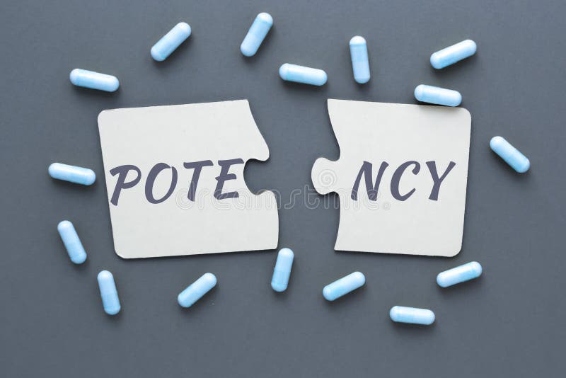 Abstract photo of problems with potencies, two jigsaw puzzles with the words potency and pill capsules on a blue background