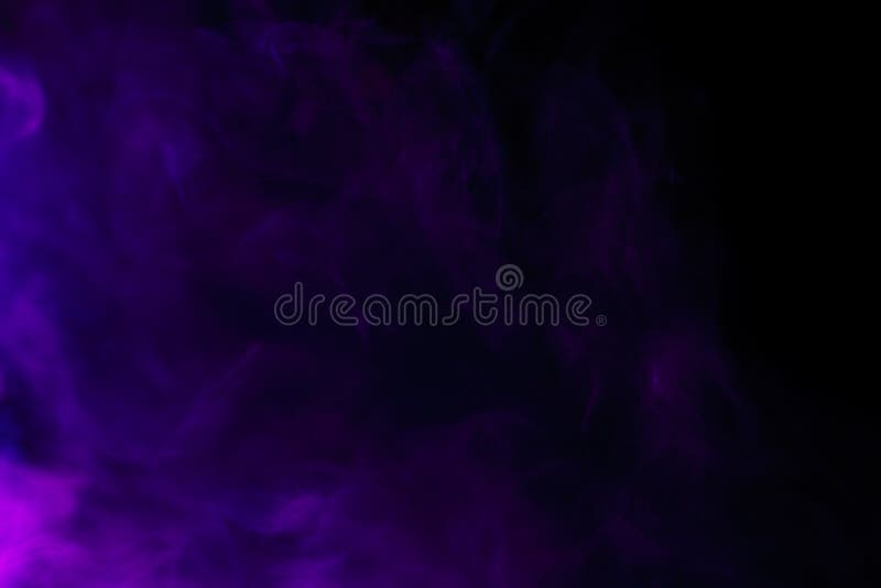 Abstract purple hookah smoke on a black background. Photographed using a gel filter. The concept of of unhealthy. Abstract purple hookah smoke on a black background. Photographed using a gel filter. The concept of of unhealthy.
