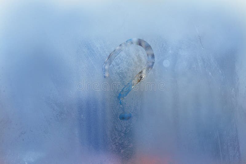 Abstract question mark on blue misted window stock photo